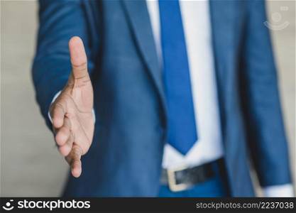 businessman reaching out his hand
