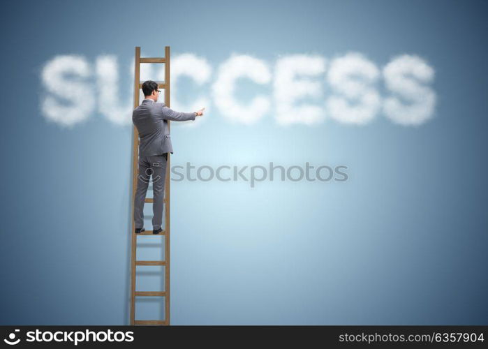 Businessman reaching success with career ladder