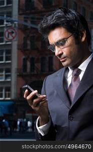Businessman reading a text message