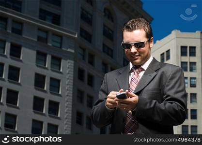 Businessman reading text message