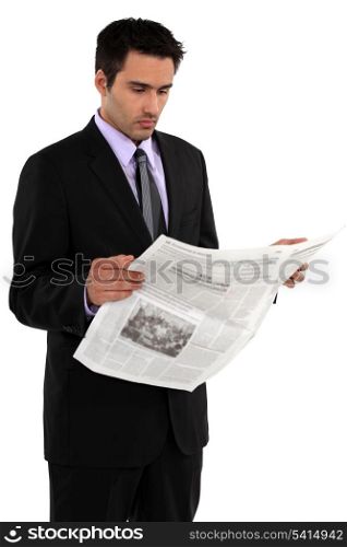 Businessman reading the newspaper