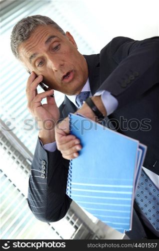 Businessman realizing he is late