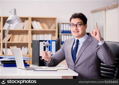 Businessman receiving award in the office
