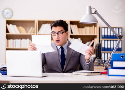 Businessman receiving letter envelope in office