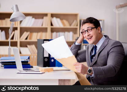 Businessman receiving letter envelope in office