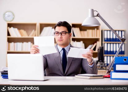 Businessman receiving letter envelope in office