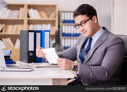Businessman receiving letter in the office