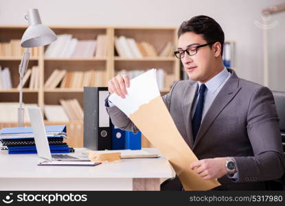 Businessman receiving letter in the office