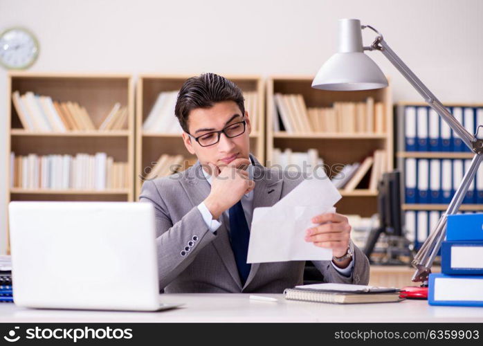 Businessman receiving letter in the office