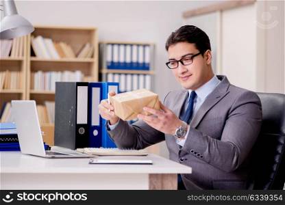 Businessman receiving parcel in office