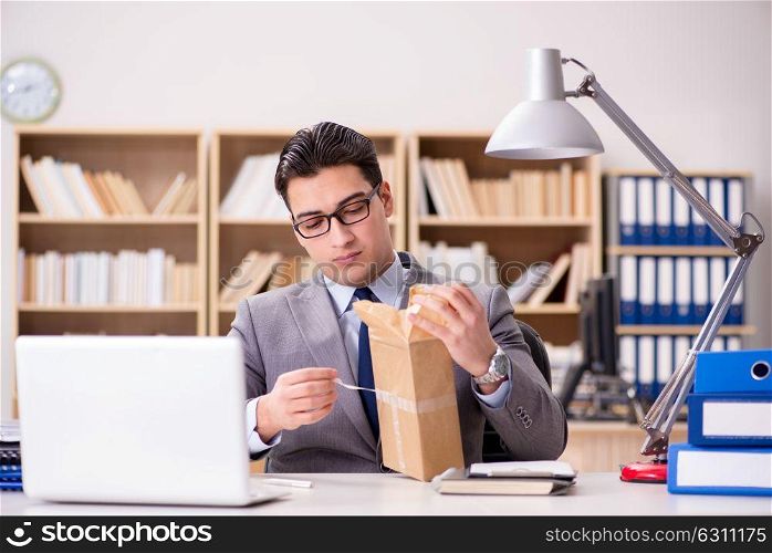 Businessman receiving parcel in the office