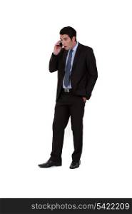 Businessman receiving shocking news over the telephone