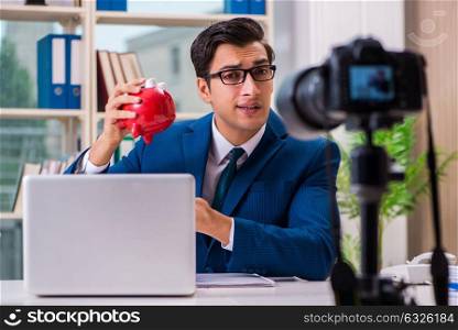 Businessman recording a video for vlog