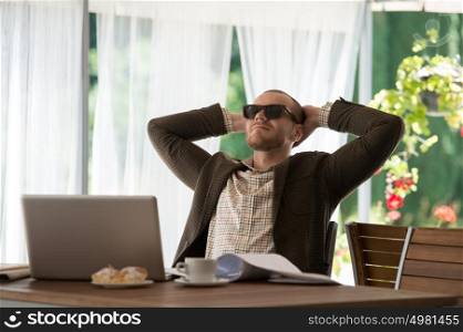 Businessman relaxing at cafe