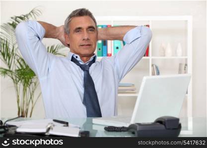 businessman relaxing in his office