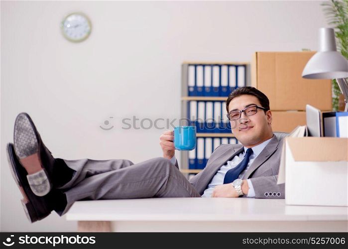 Businessman relaxing in office after busy day