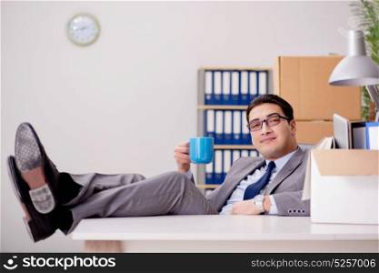 Businessman relaxing in office after busy day