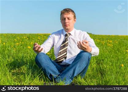businessman relaxing relieves stress in the field