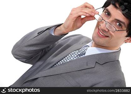 Businessman removing glasses