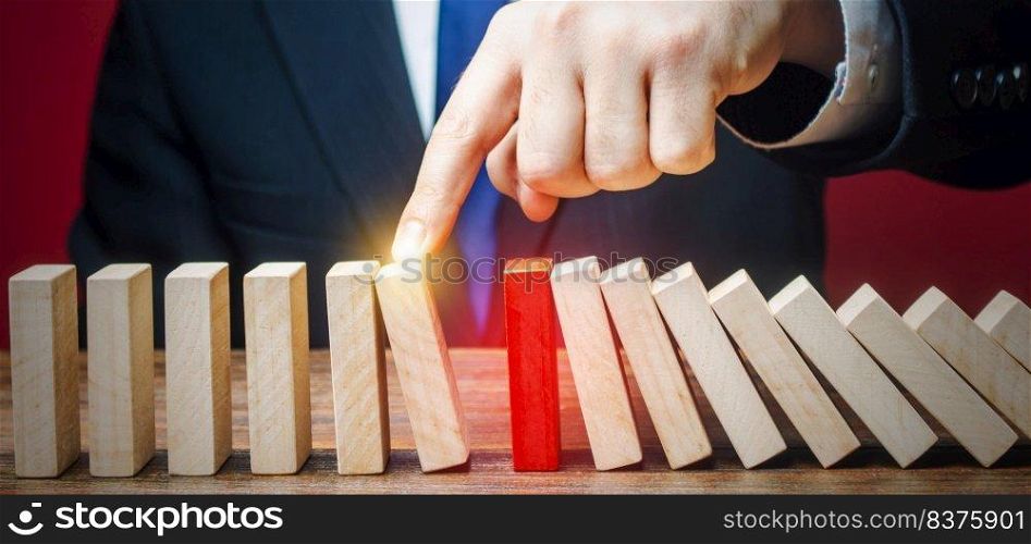 Businessman restarts the process of falling dominoes. Start work after stopping. Continuation of working, obstacle avoidance. maintainability. After the weekend. Correction of errors and malfunctions.