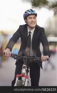 Businessman riding a bicycle, Beijing