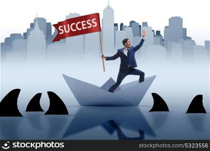 Businessman riding paper boat ship in success concept
