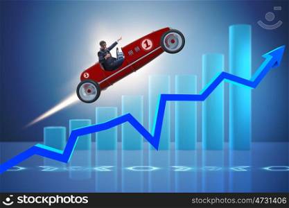 Businessman riding sports car against charts