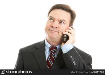 Businessman rolling his eyes as he listens to a boring phone call or message. Isolated on white.