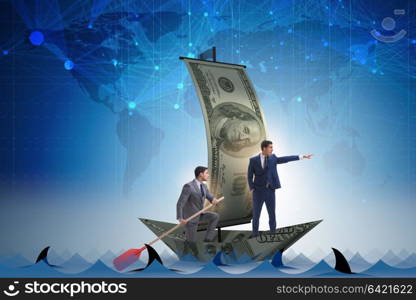 Businessman rowing on dollar boat in business financial concept