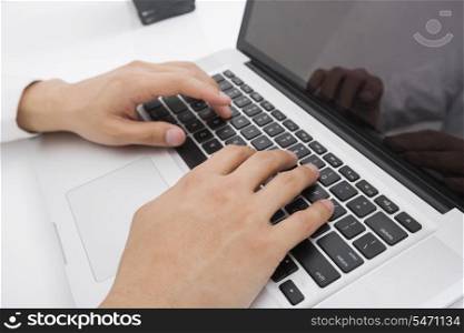 Businessman&rsquo;s hands using laptop