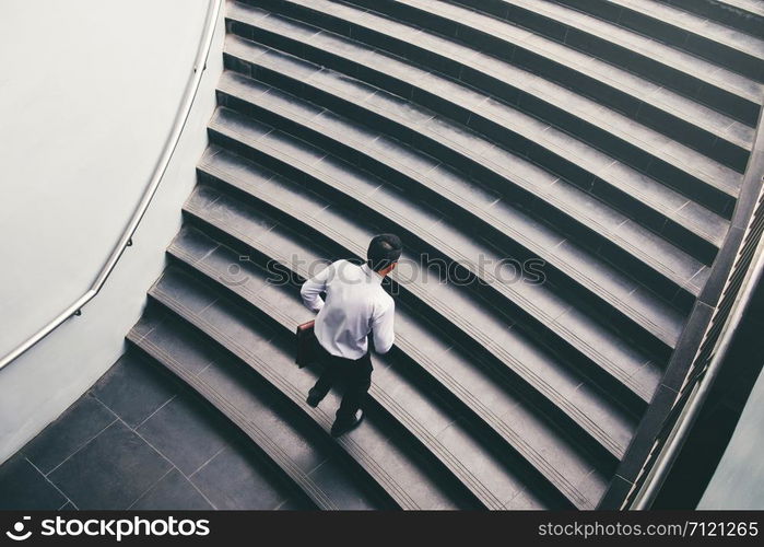 Businessman running fast upstairs Growth up Success concept