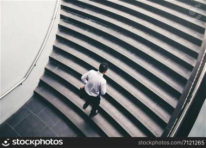 Businessman running fast upstairs Growth up Success concept