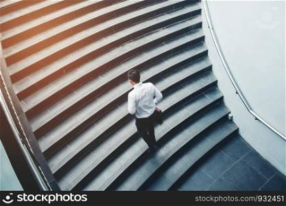 Businessman running fast upstairs Growth up Success concept