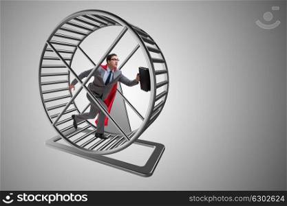 Businessman running on hamster wheel