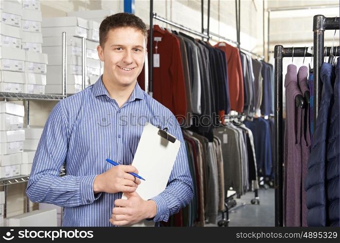 Businessman Running On Line Fashion Business With Clipboard