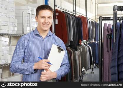 Businessman Running On Line Fashion Business With Clipboard