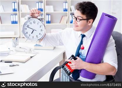 Businessman rushing to sports with clock