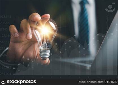 Businessman’s hand protects a glowing light bulb, symbolizing a creative solution. Illustrates the concept of innovation, inspiration, and successful profit in global business.