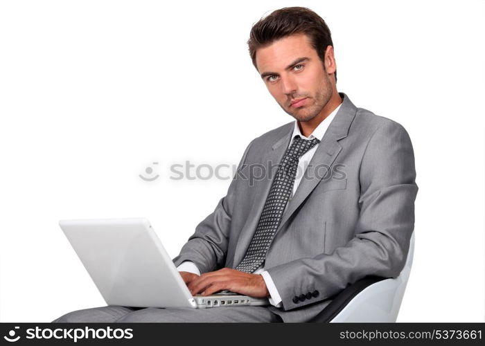 Businessman sat in chair