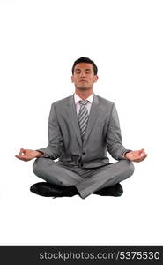 Businessman sat in lotus position