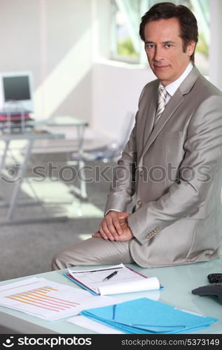 Businessman sat on table