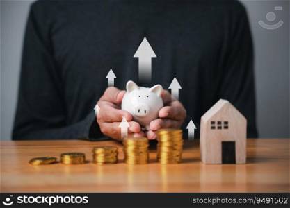 Businessman saving money with a piggy bank and coins, charting the growth of his investment. A concept for saving and financial planning for the future and retirement.
