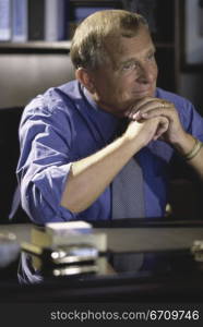 Businessman seated behind an office desk