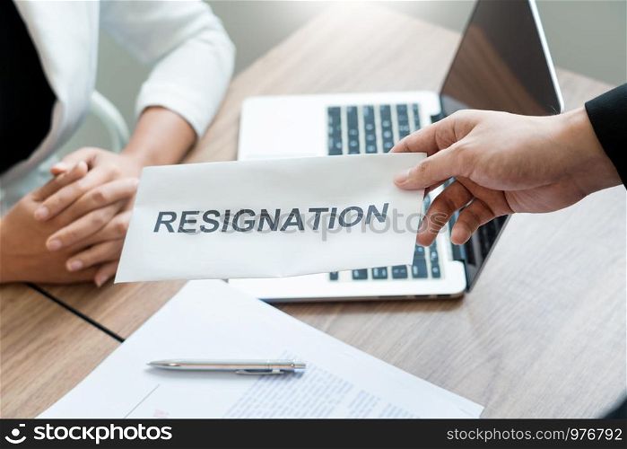 Businessman sending resignation letter to employer boss Including about resignation from positions and vacancies, changing and resigning from work concept for quit or change of job leaving the office, unemployment.