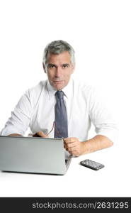 businessman senior gray hair working laptop computer white desk background