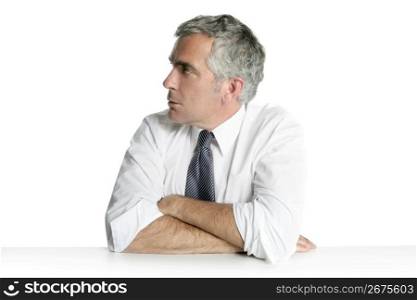 businessman senior profile relaxed sit portrait white desk background