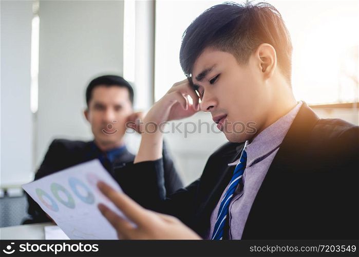 businessman serious about the work hard done until the headache