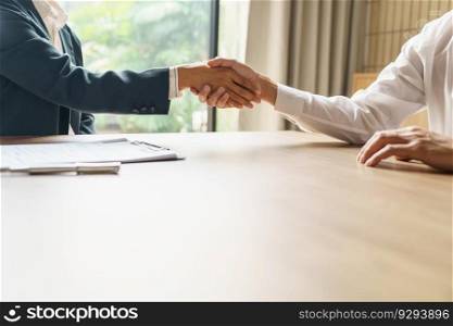 Businessman shaking hands successful candidate at interview. got the job in the team. Welcome aboard successful making a deal. partnership meeting concept.