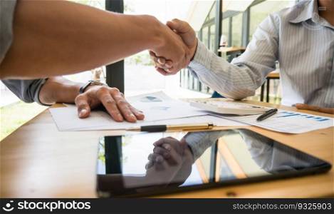 Businessman shaking hands successful candidate at interview. got the job in the team. Welcome aboard successful making a deal.
partnership meeting concept.