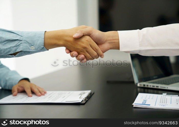 Businessman shaking hands successful candidate at interview. got the job in the team. Welcome aboard successful making a deal. partnership meeting 